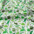 Cotton fabric, by the meter. Dinosaurs Green on White